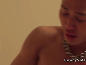 Asian gay action star, a hunk with a big dick, dominates a man from the set. He expertly sucks and fucks him, leading to a wild, bareback encounter.