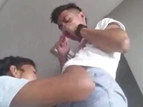 A young, Asian lad eagerly indulges in a big cock, expertly using his mouth and hands to pleasure his older partner. This passionate encounter showcases an intense gay encounter with skilled oral techniques.