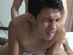 Steamy gay action unfolds as a mature daddy gets down and dirty with his Asian twink, Benjie. The foot fetish begins with a foot massage, leading to intense sucking, fucking, and a hot cum shot.