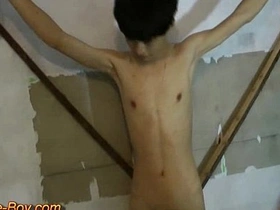 Slender Asian lad, bound and submitted, receives a firm spanking before being led to his knees. A blindfold and harness add to the BDSM ambiance as he's vigorously used in doggy style.