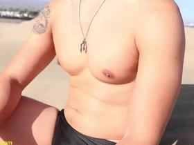 A scorching Asian dude flaunts his sculpted abs and nibbling nipples in the dunes, craving worship. His lean muscles glisten under the sun, inviting a sensual licking and edging adventure.