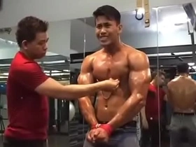 As a gay Asian gym rat, he's not just sculpting his body, but also his partner's. This kinky plan unfolds with nipple torture, a BDSM twist to their workout routine.