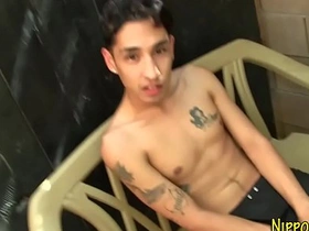 A hot Japanese guy with tattoos on his back masturbates outdoors. His big cock gets jerked off to a creamy climax. This gay teen's solo session is a must-see for fans of Asian gay sex.
