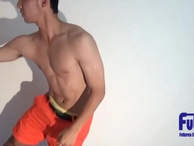 A sporty guy flaunts his chiseled physique and adorable short hair. Indulging in gay sex, he eagerly receives a deepthroat and engages in passionate anal, showcasing his amateur skills.