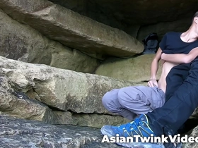 Young interracial gay couple explores paradise, frolicking in a lagoon. The white twink and Asian stud passionately make love, surrounded by nature's beauty in a secluded cave.