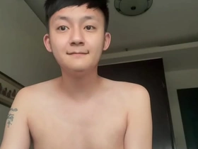 Skinny Asian lad indulges in self-pleasure, stroking his slender shaft to a creamy climax. This gay amateur's raw talent and intense orgasm create an enticing, erotic spectacle.