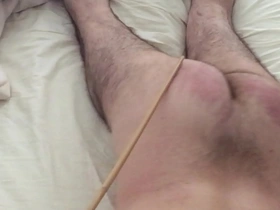 Ass warming with cane