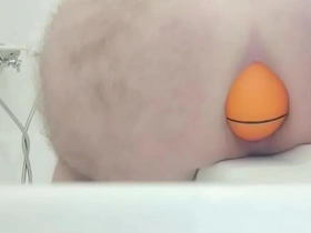 Huge 12cm wide soccer ball slides out of my ass on side of bath.